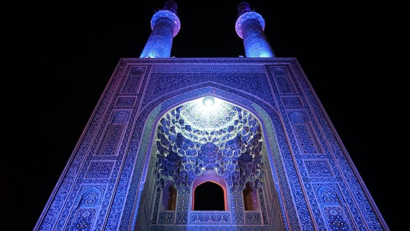 jame mosque at night with blue light at this in yazd